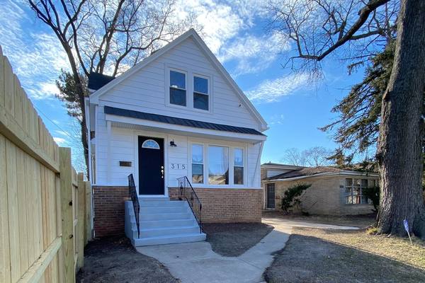 Rear of a frame cottage, siding replaced. The housing stock in Back of the Yards and Canaryville is mostly frame workers cottages.