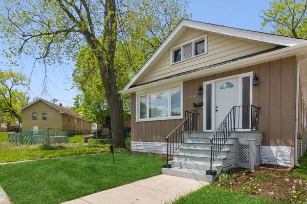 Frame house with a rebuilt front stair and entry. The housing stock in Beverly and Morgan Park is mostly frame houses.