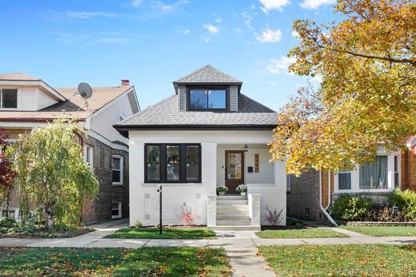 Brick bungalow front elevation, walkway and entry rebuilt. The housing stock in Chatham and Avalon Park is mostly brick bungalows.
